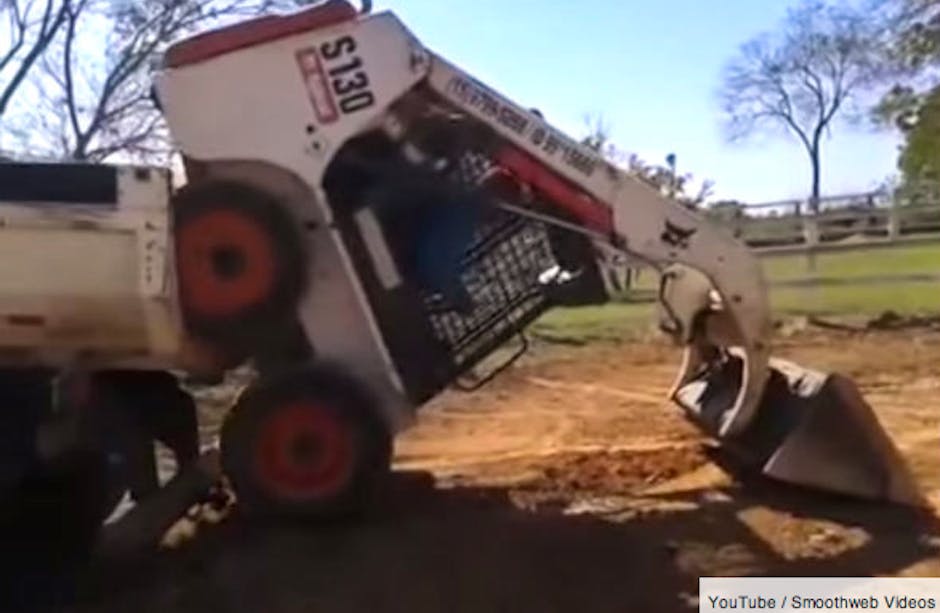 This is how you load a bobcat digger onto a trailer