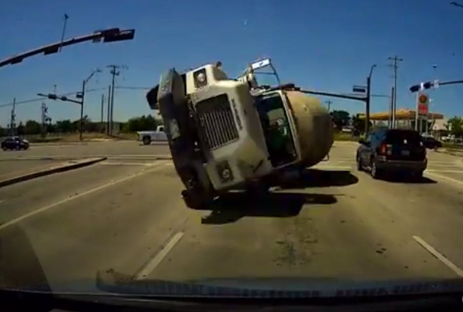 Watch this cement truck flip and slam into a car | Recombu