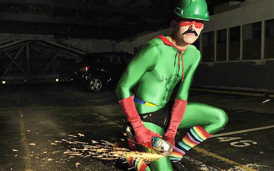 Wheel Clamp Man removes car clamps with angle grinder