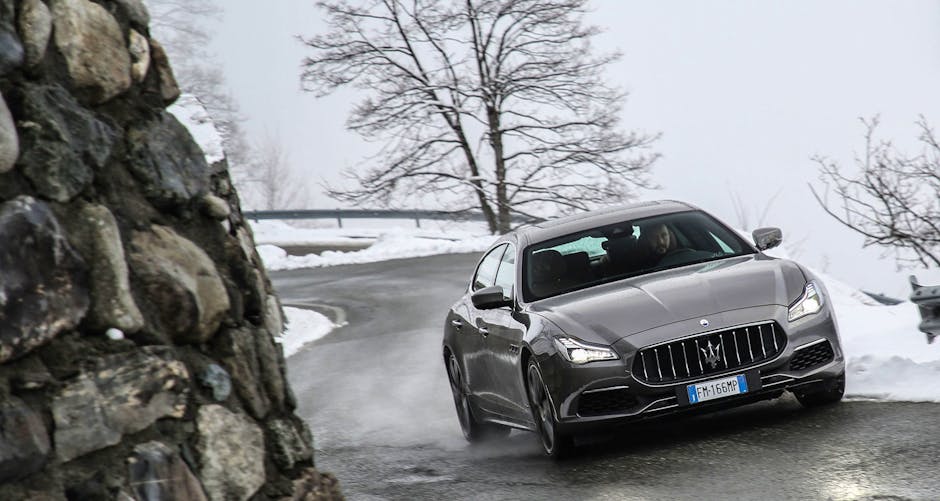 Maserati Quattroporte GTS 2018 cruising along an icy mountain road